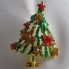Brosche Tannenbaum gruen-goldfarben plattiert, Emaille mit Strass.