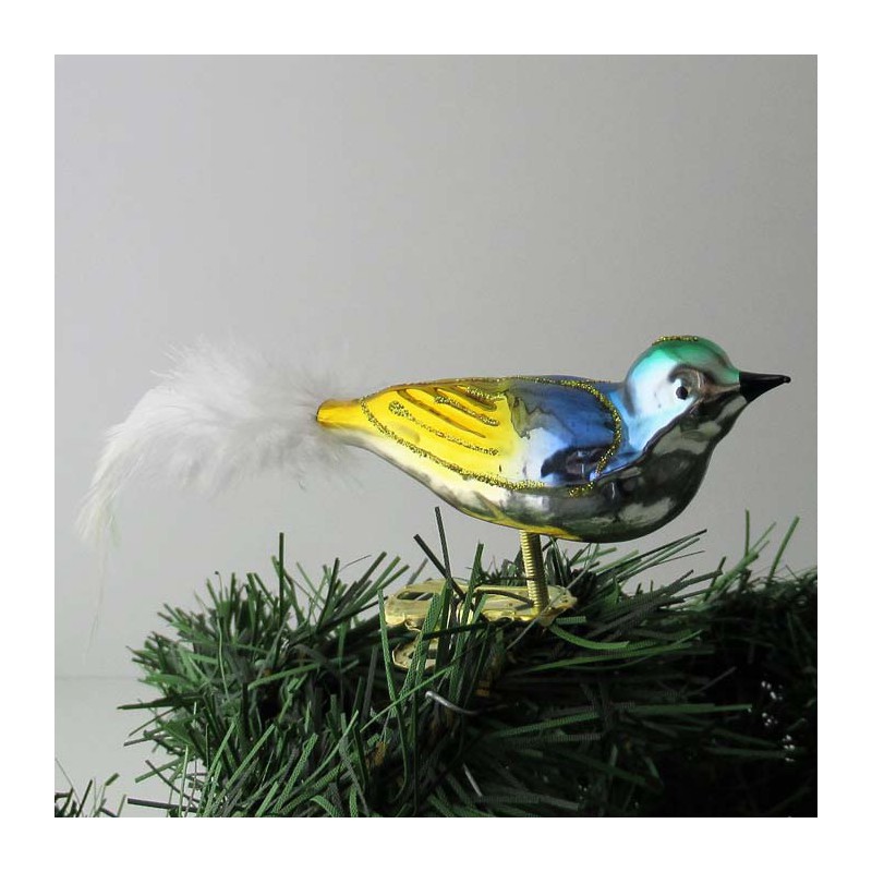 Glasvogel kl. Vogel mit gedrehten Kopf, und weisse  Naturfedern