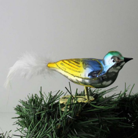 Glasvogel kl. Vogel mit gedrehten Kopf, und weisse  Naturfedern