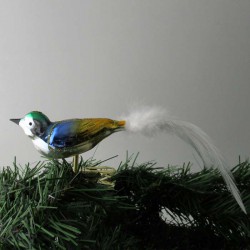 Glasvogel kl. Vogel mit gedrehten Kopf, und weisse  Naturfedern
